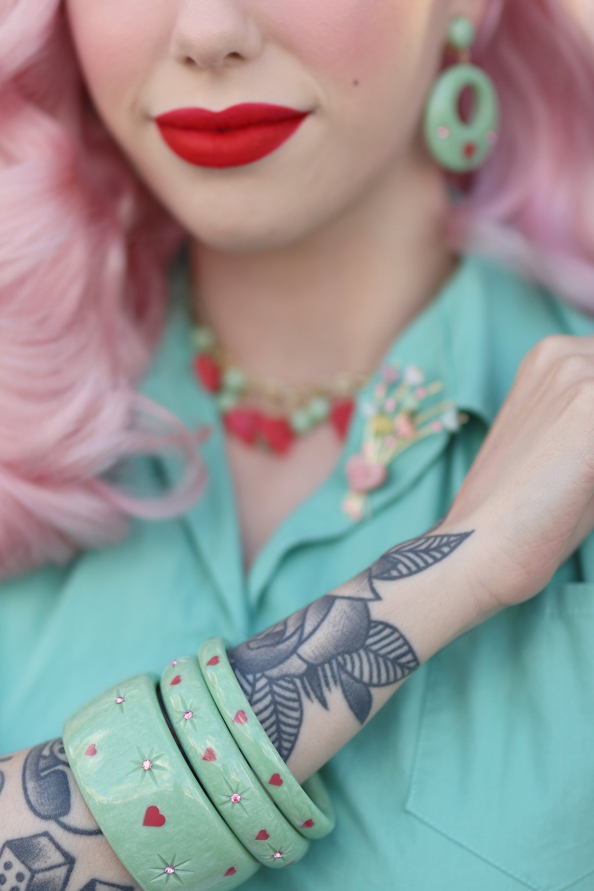 Splendette vintage inspired 1950s Valentine's style pastel green Sweet Pea fakelite jewellery worn by pin up model Dafna Bar-El
