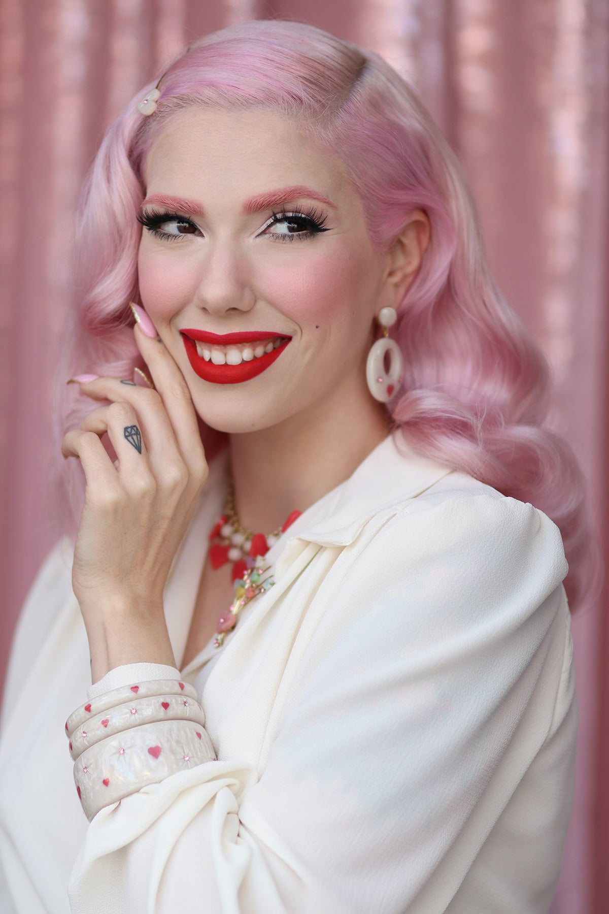 Splendette vintage inspired cute 1950s style carved white Sugar jewellery worn by pin up model Dafna Bar-El