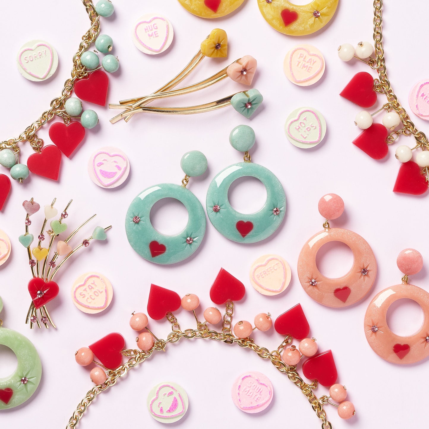Splendette vintage inspired 1950s style pastel Valentine's jewellery flat lay with earrings, necklaces, brooch and hair slides