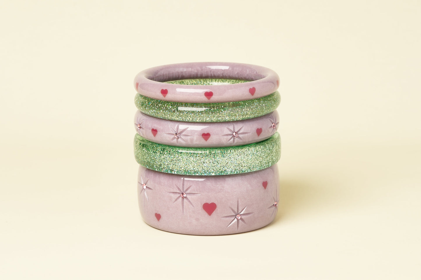 Splendette vintage inspired 1950s Valentine's style pastel purple Poppet bangles stacked with Green Lagoon glitter bangles