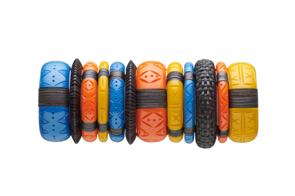 Splendette vintage inspired 1940s 1950s holiday vacation inspired carved fakelite bangle stack with dark woven bangles. Blue Pacific, yellow Ochre and orange Tangerine.
