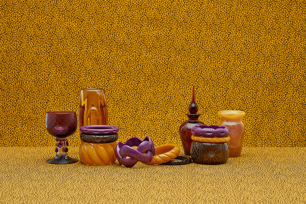 Splendette vintage inspired 1940s style display of Golden fakelite carved bangles including purple Plum, yellow Mustard, and brown Espresso with retro home glass accessories