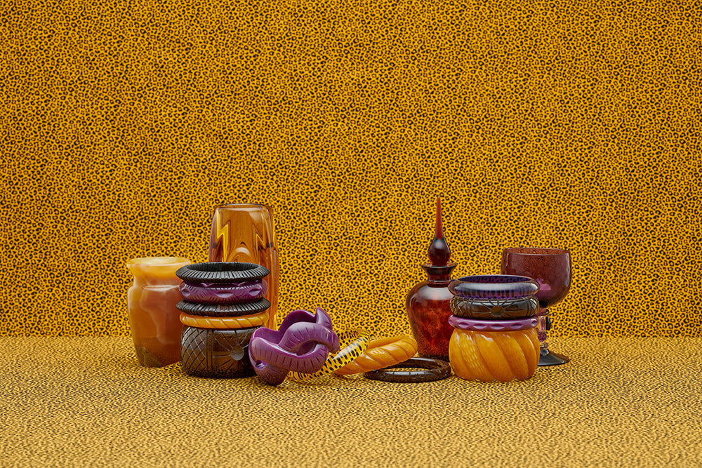 Splendette vintage inspired 1940s style display of Golden fakelite carved bangles including purple Plum, yellow Mustard, and brown Espresso with retro home glass accessories