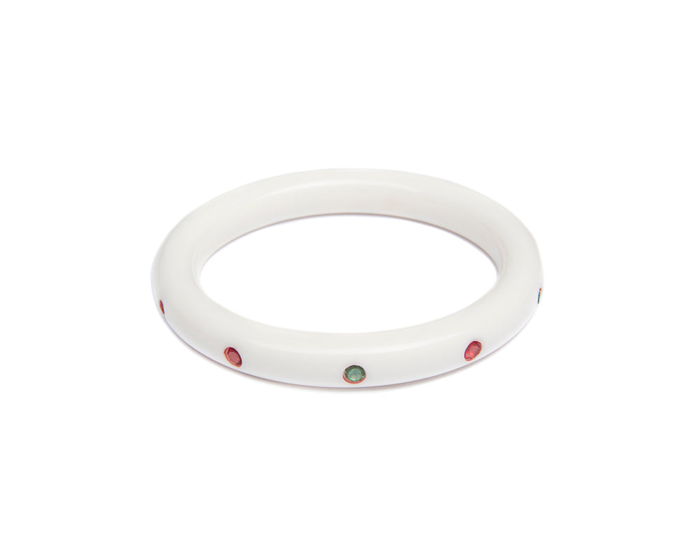 Splendette vintage inspired 1950s mid-century Christmas style white Narrow Lumi Atomic Snowflake Bangle in smaller Maiden size with red and green diamantes