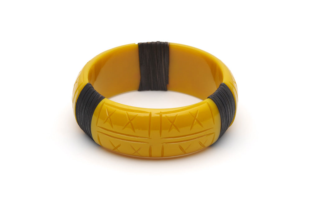 Splendette vintage inspired 1940s 1950s tropical style carved yellow fakelite Wide Ochre Dark Cane Bangle in larger Duchess size.