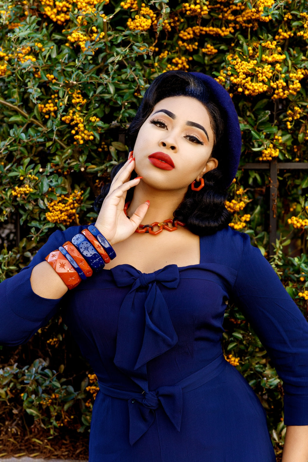 Splendette vintage inspired retro style orange Rust and blue Darkness fakelite jewellery worn by model Lady Eccentrik B