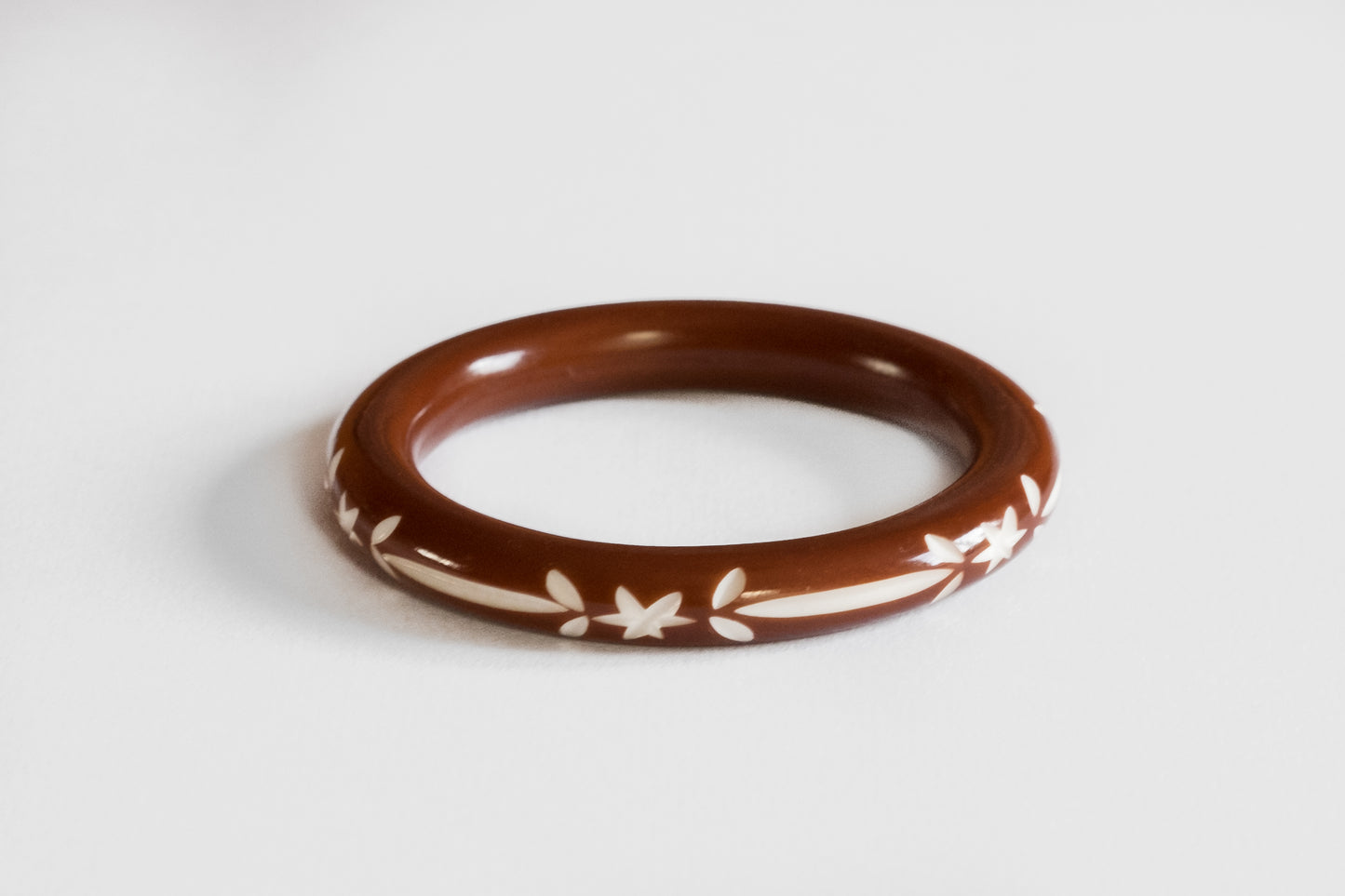Narrow Carved Bangle Brown