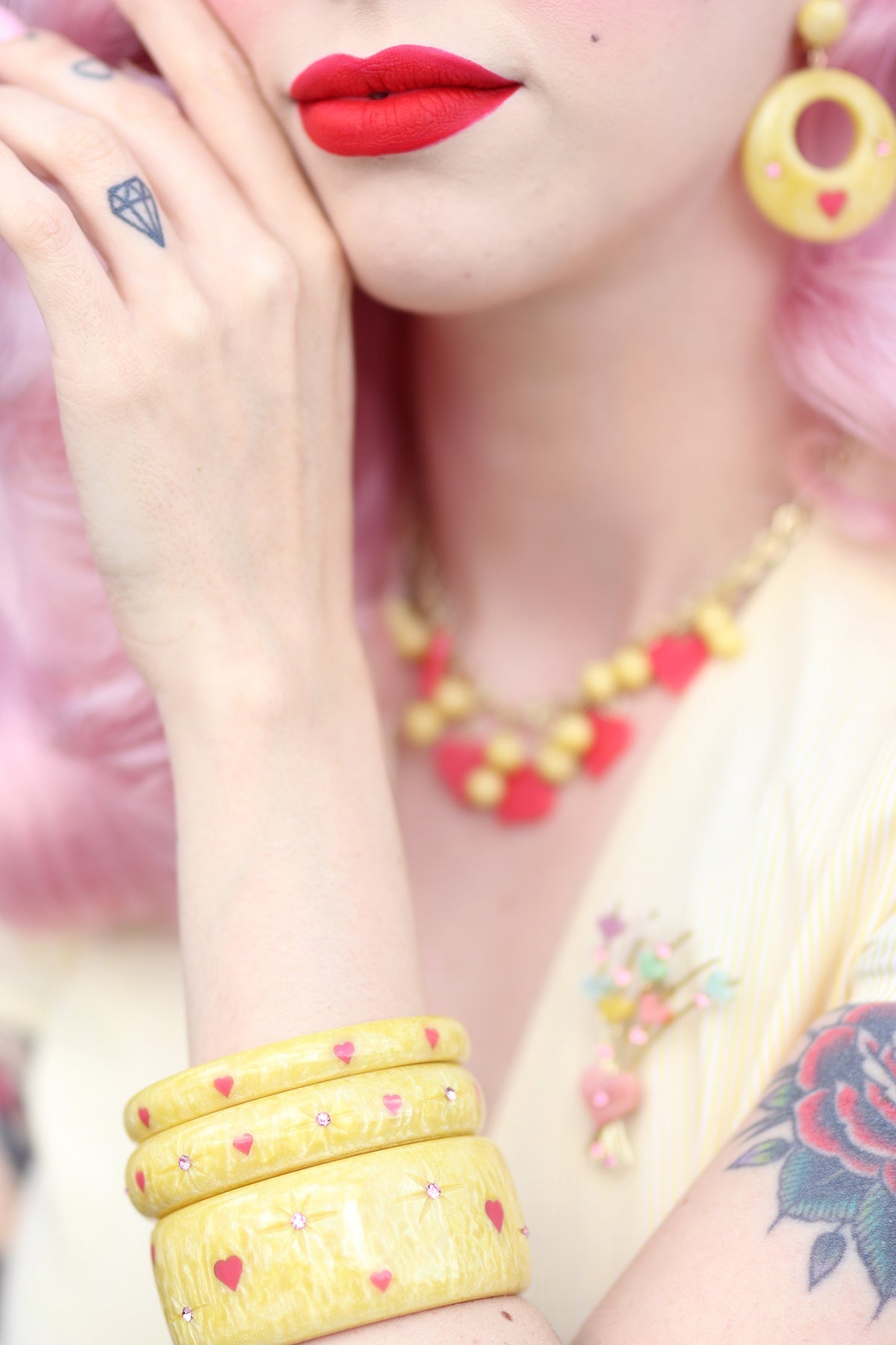 Splendette vintage inspired 1950s kitsch Valentine's style pastel yellow Honey Bunch jewellery worn by pin up model Dafna Bar-El