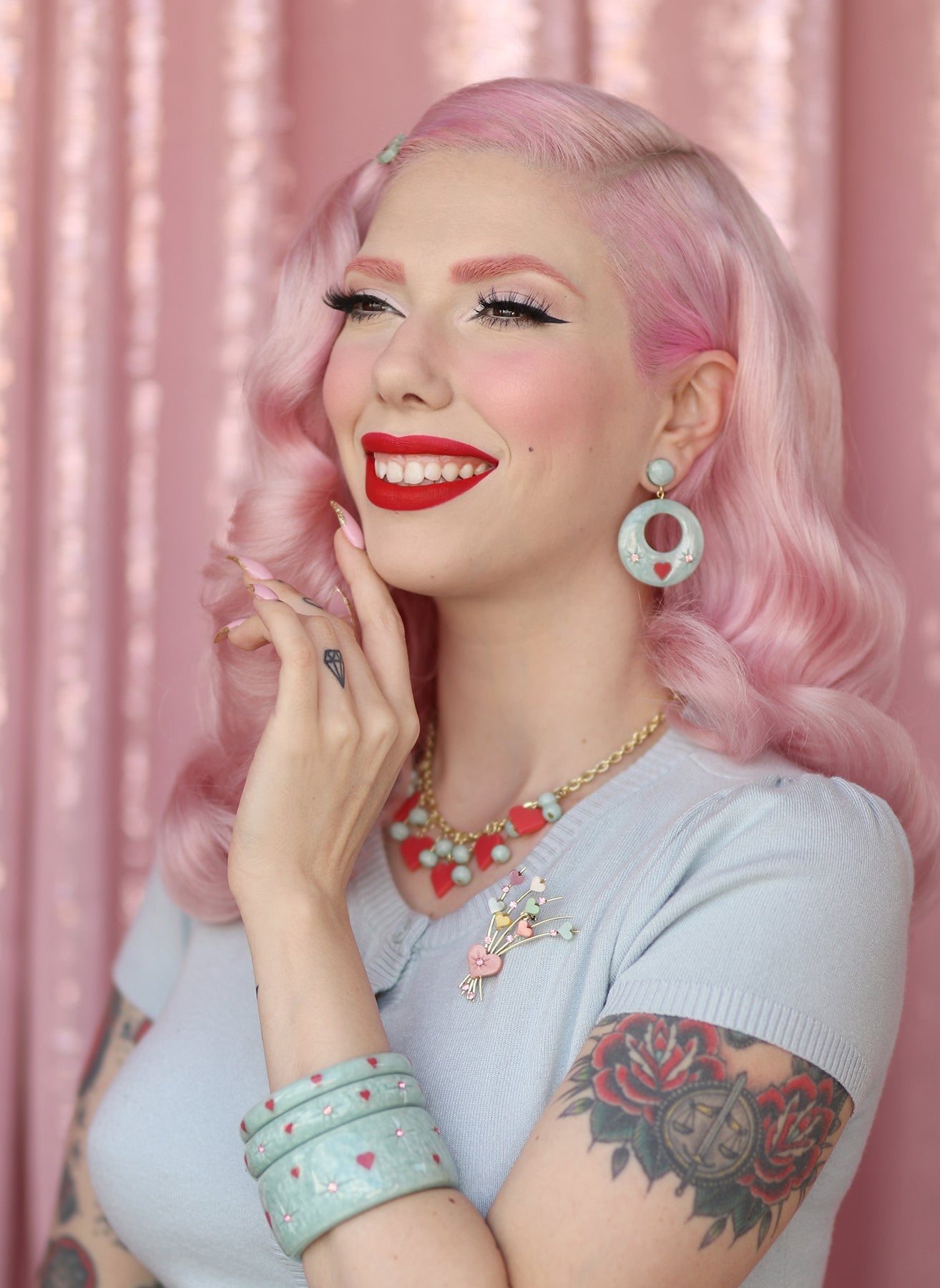 Splendette vintage inspired 1950s Valentine's style pastel blue carved Baby Doll jewellery worn by pin up model Dafna Bar-El
