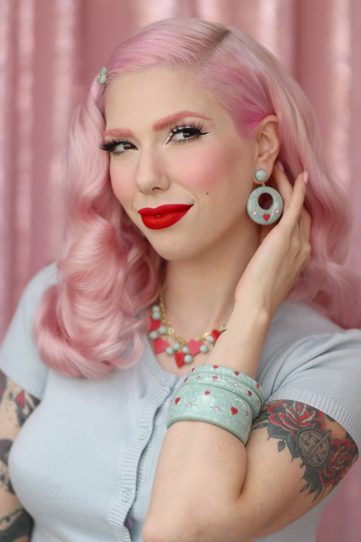 Splendette vintage inspired 1950s Valentine's style pastel blue carved Baby Doll jewellery worn by pin up model Dafna Bar-El
