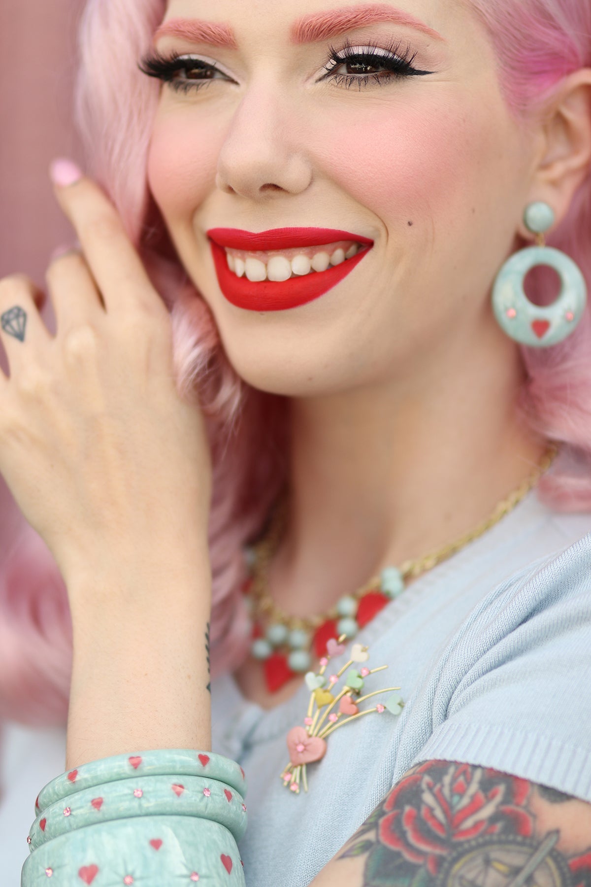 Splendette vintage inspired 1950s Valentine's style pastel blue carved Baby Doll jewellery worn by pin up model Dafna Bar-El