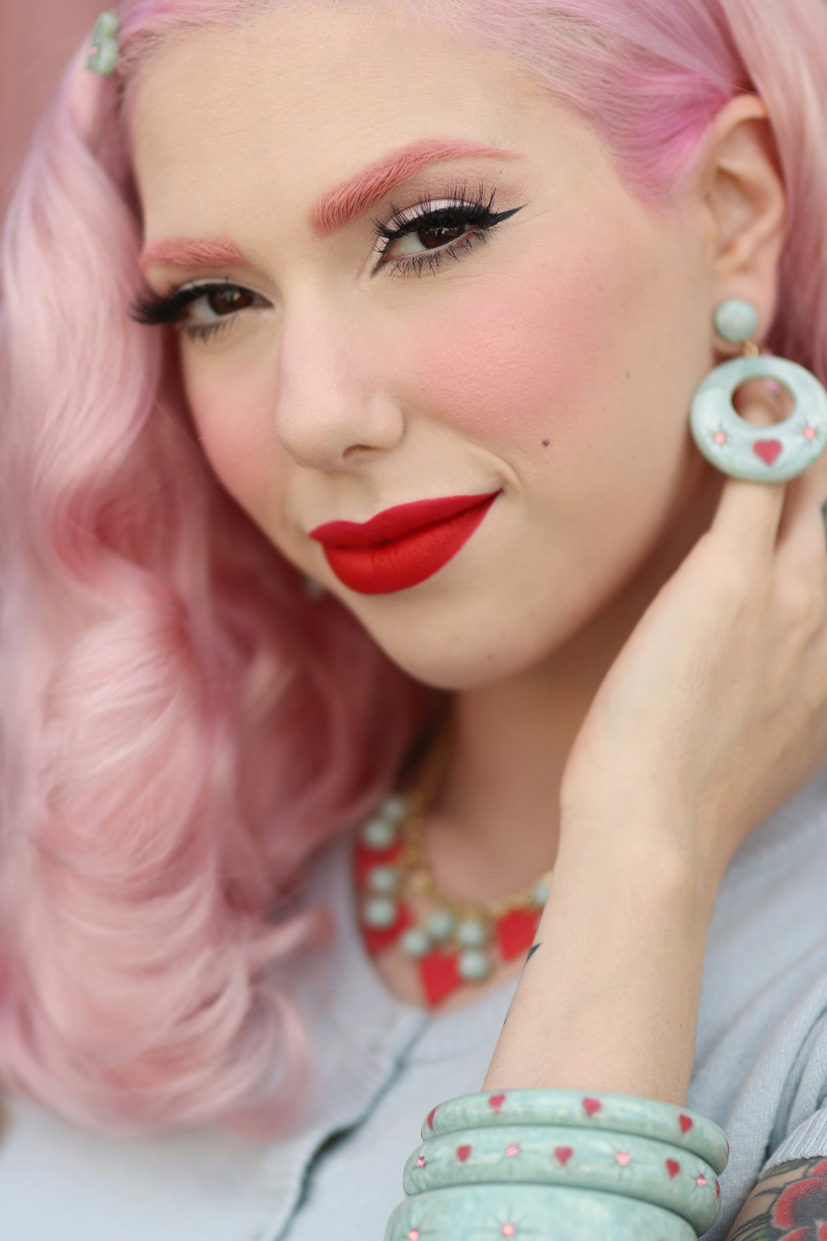 Splendette vintage inspired 1950s Valentine's style pastel blue carved Baby Doll jewellery worn by pin up model Dafna Bar-El