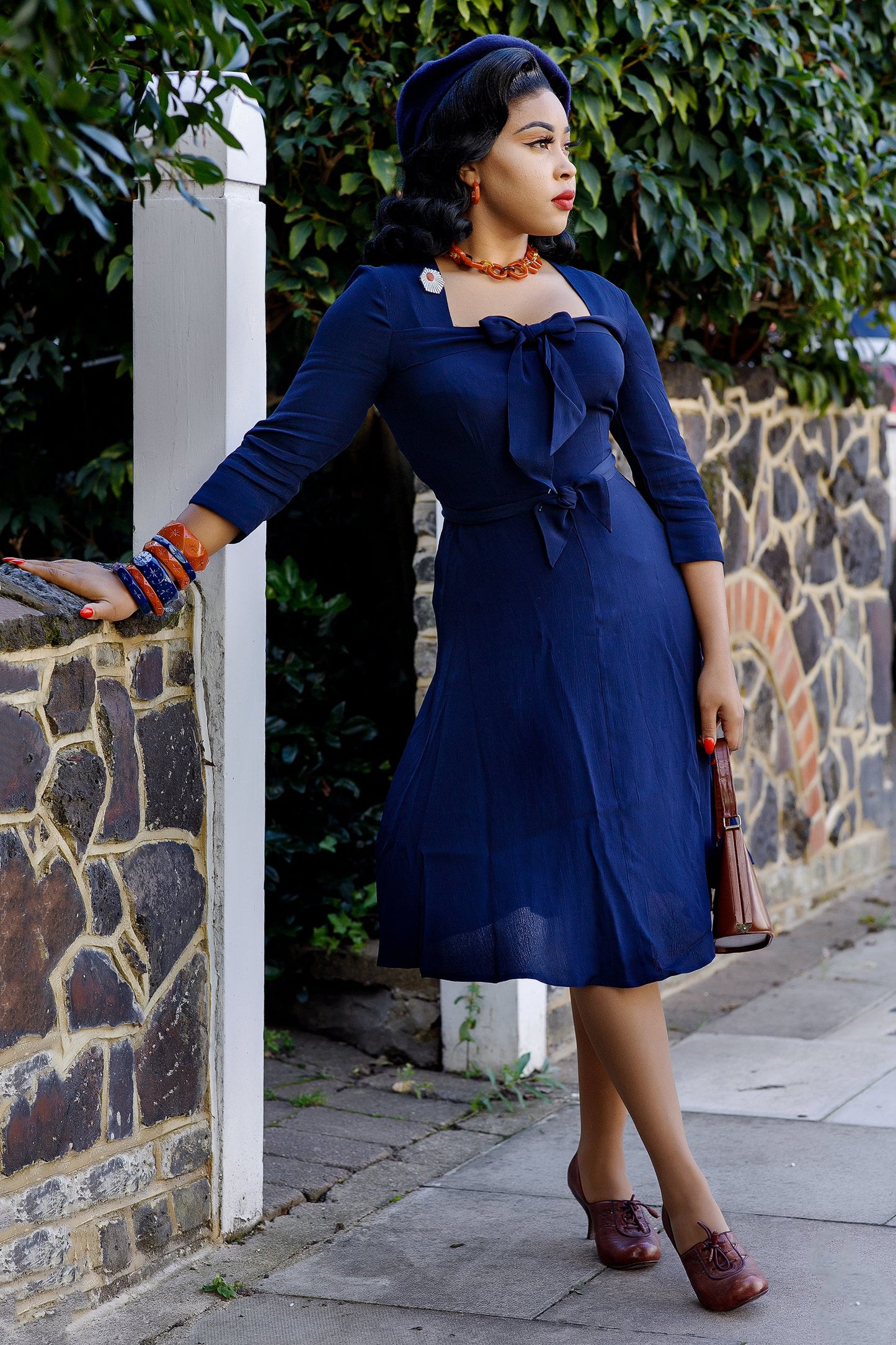 Splendette vintage inspired retro style orange Rust and blue Darkness fakelite jewellery worn by model Lady Eccentrik B