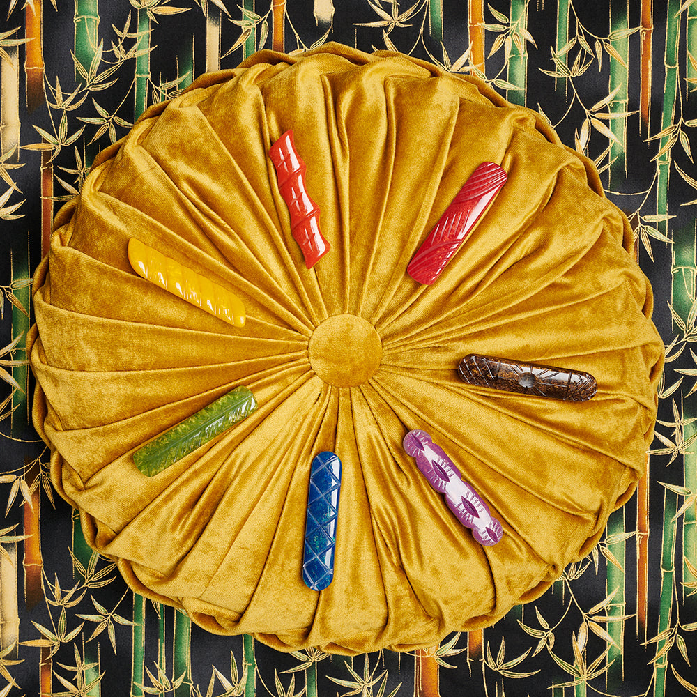 Splendette vintage inspired 1940s style flat lay of Autumn 2020 Golden fakelite Hair Barettes on golden cushion
