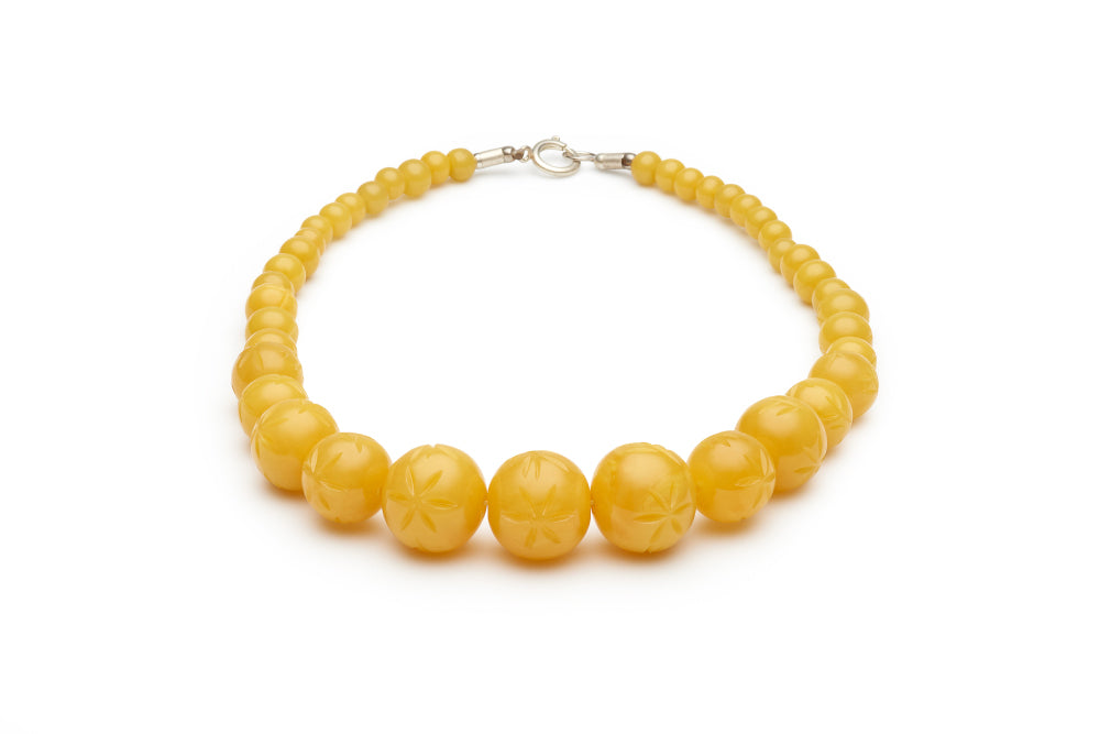 Carved Marigold Fakelite Beads