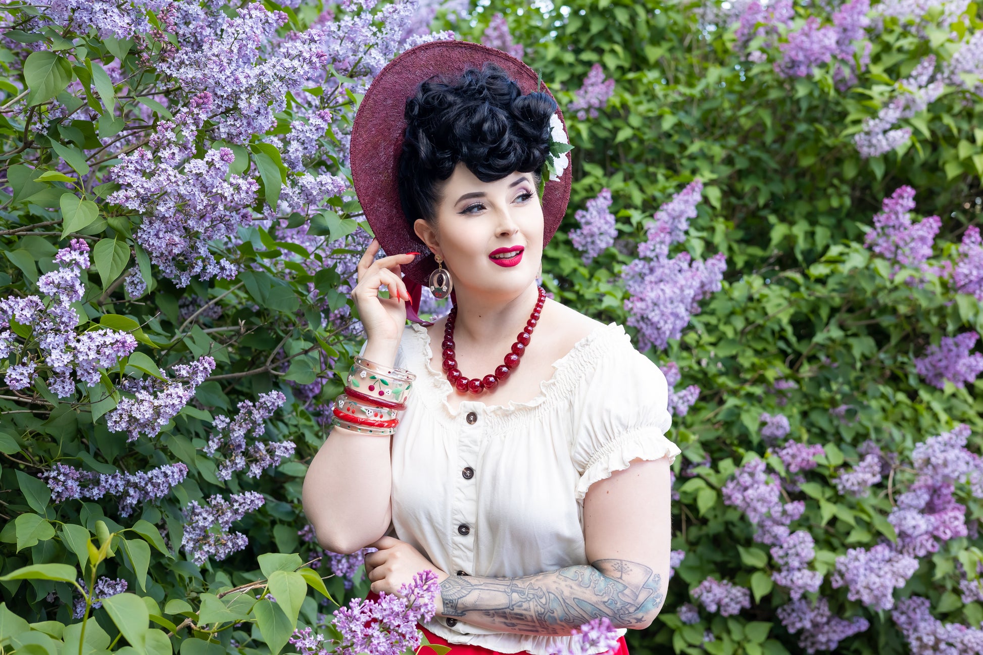 Splendette vintage inspired 1940s Bakelite style rockabilly red Cherries jewellery worn by pin up model