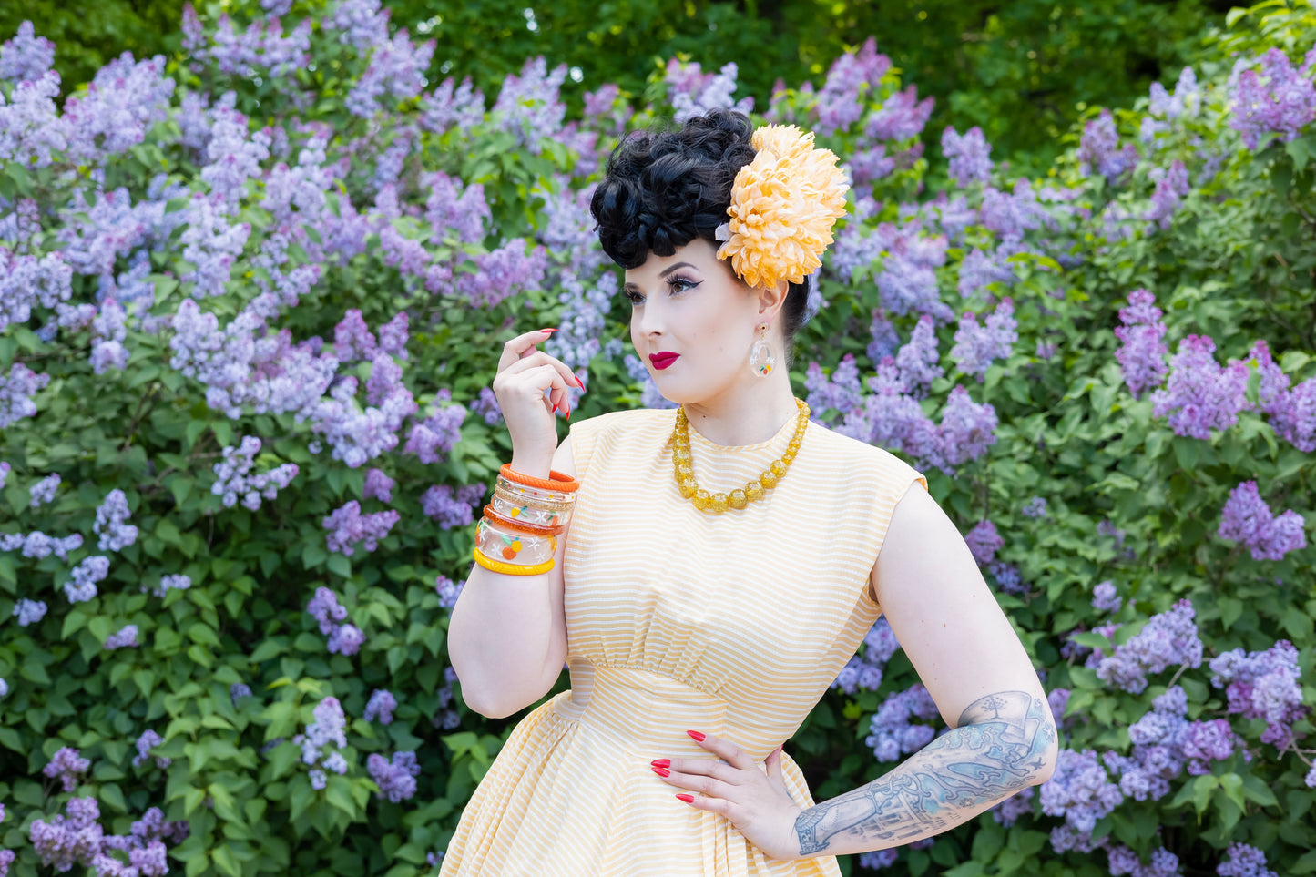 Splendette vintage inspired 1940s style orange and yellow Citrus fakelite worn by pin up model