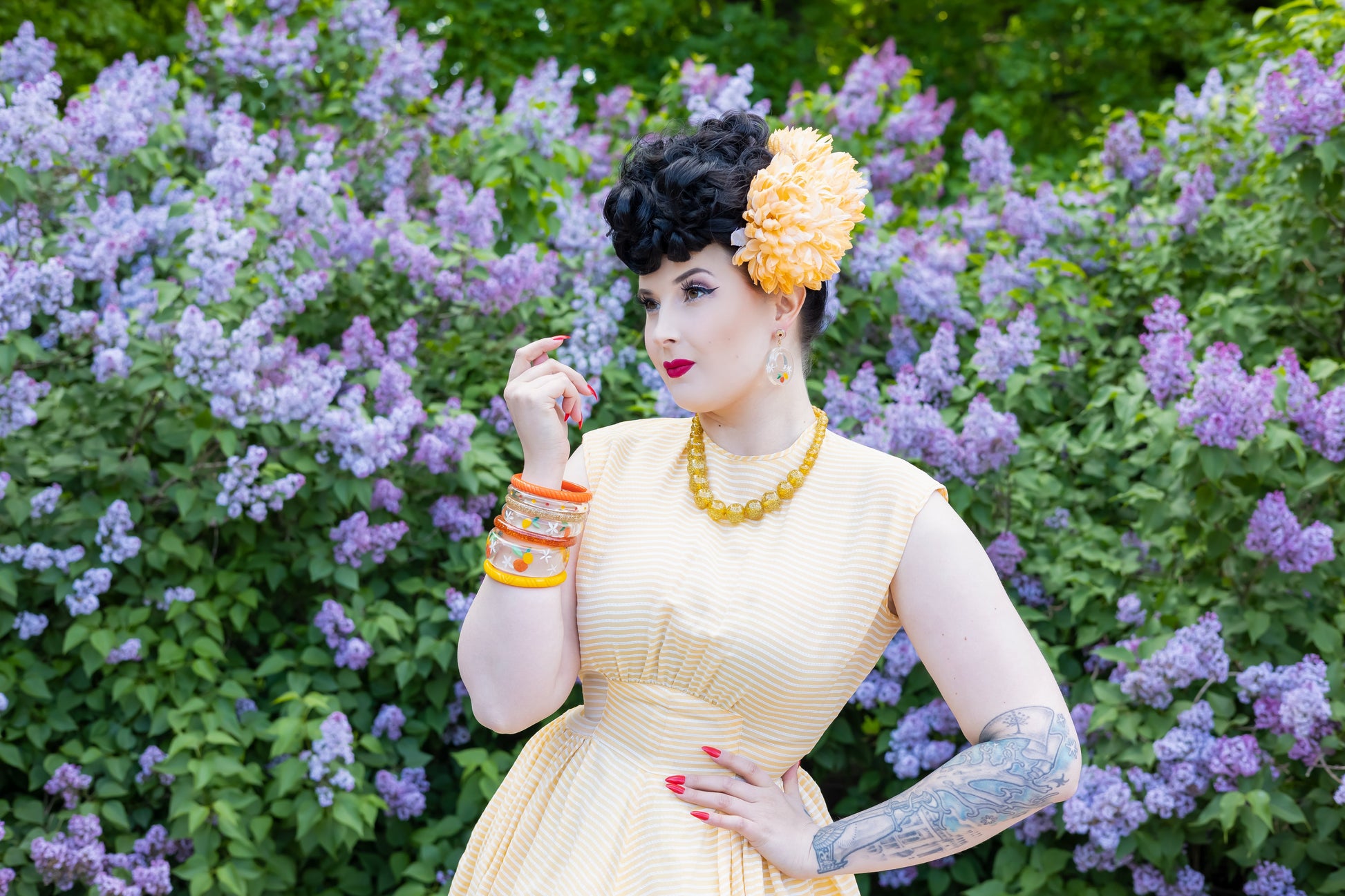 Splendette vintage inspired 1940s style orange and yellow Citrus fakelite worn by pin up model