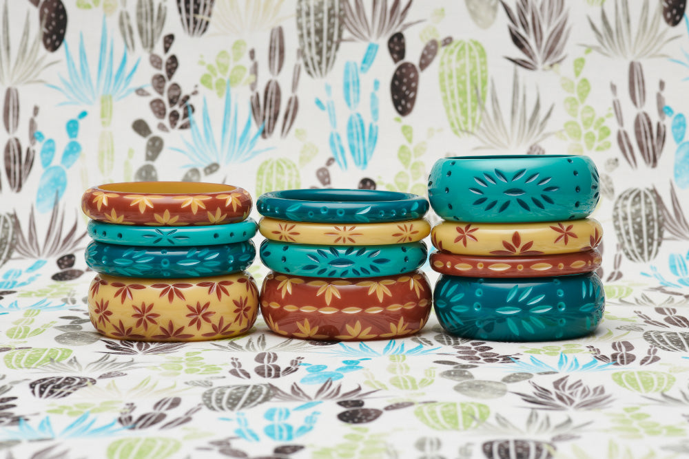 Splendette vintage inspired 1950s style carved Duotone fakelite bangles in three stacks with turquoise and teal Dragonfly & Nymph, and brown and cream Café & Lait