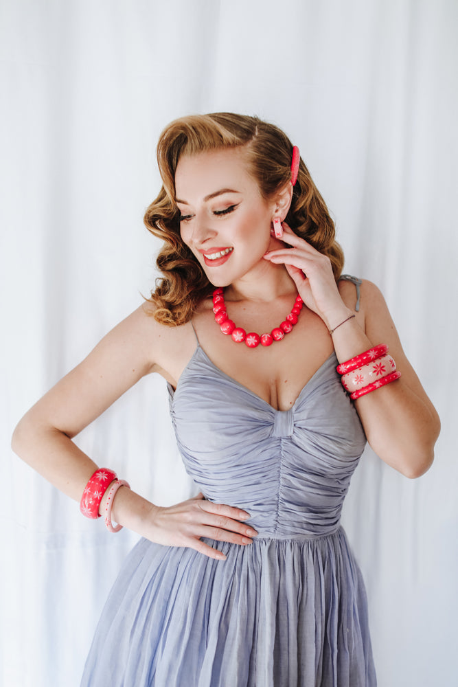 Splendette vintage inspired 1950s pin up style Spring 2021 carved pink Duotone jewellery in Raspberry and Ripple worn by Blossom & Buttercups