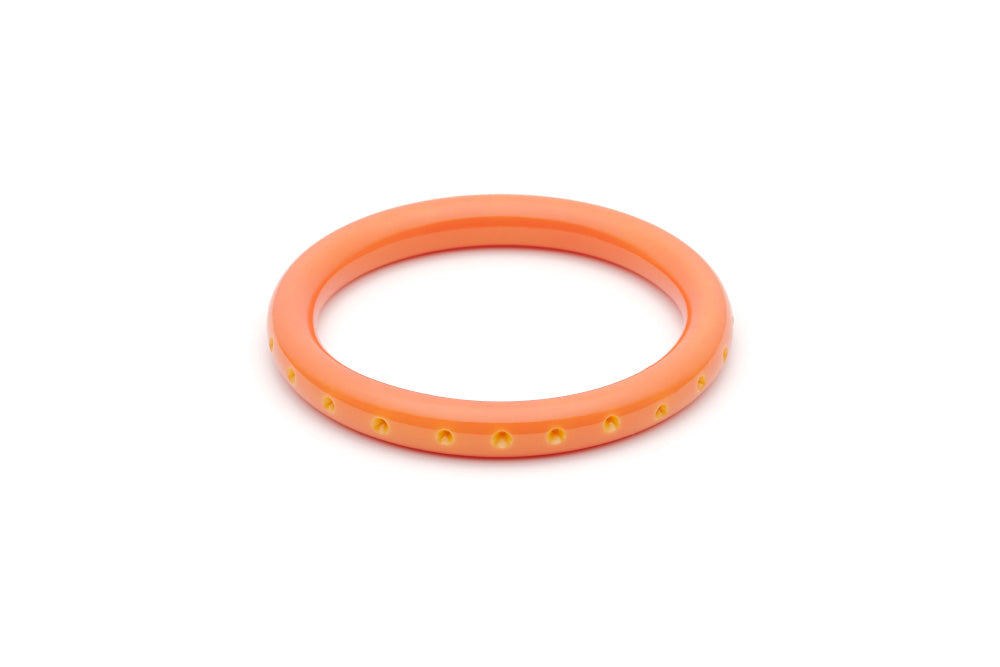 Splendette vintage inspired 1950s Bakelite style peachy orange Duotone fakelite Narrow Freesia Carved Bangle in Classic size