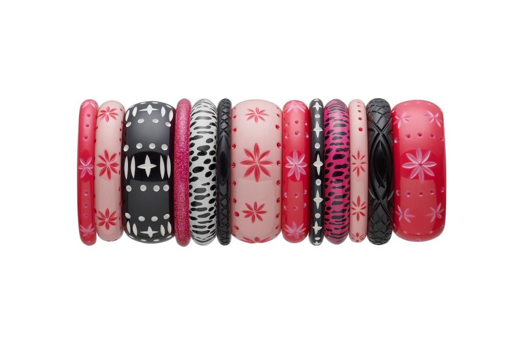Splendette vintage inspired 1950s pin up rockabilly style carved fakelite bangle stack with pink Raspberry, Ripple, Fuchsia glitter, Iris leopard pring, black heavy carved, black Hater Duotone and white leopard print