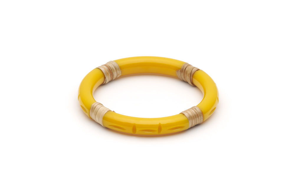 Splendette vintage inspired 1940s 1950s tropical style carved yellow fakelite Narrow Ochre Light Cane Bangle in Classic size.