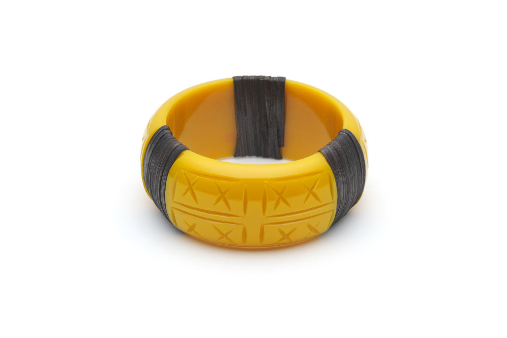 Splendette vintage inspired 1940s 1950s tropical style carved yellow fakelite Wide Ochre Dark Cane Bangle in smaller Maiden size.