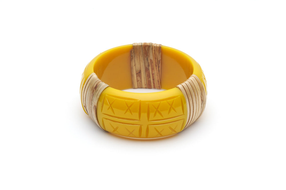 Splendette vintage inspired 1940s 1950s tropical style carved yellow fakelite Wide Ochre Light Cane Bangle in smaller Maiden size.