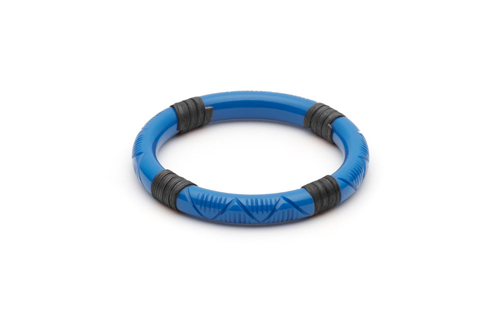 Splendette vintage inspired 1940s 1950s holiday vacation style carved blue fakelite Narrow Pacific Dark Cane Bangle in Classic size.