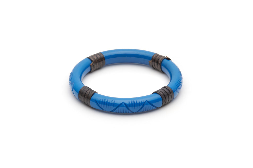 Splendette vintage inspired 1940s 1950s holiday vacation style carved blue fakelite Narrow Pacific Dark Cane Bangle in smaller Maiden size.