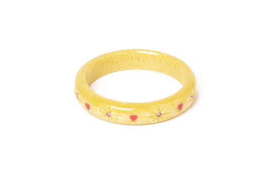 Splendette vintage inspired 1950s kitsch Valentine's style pastel yellow carved fakelite Midi Honey Bunch Starburst Bangle