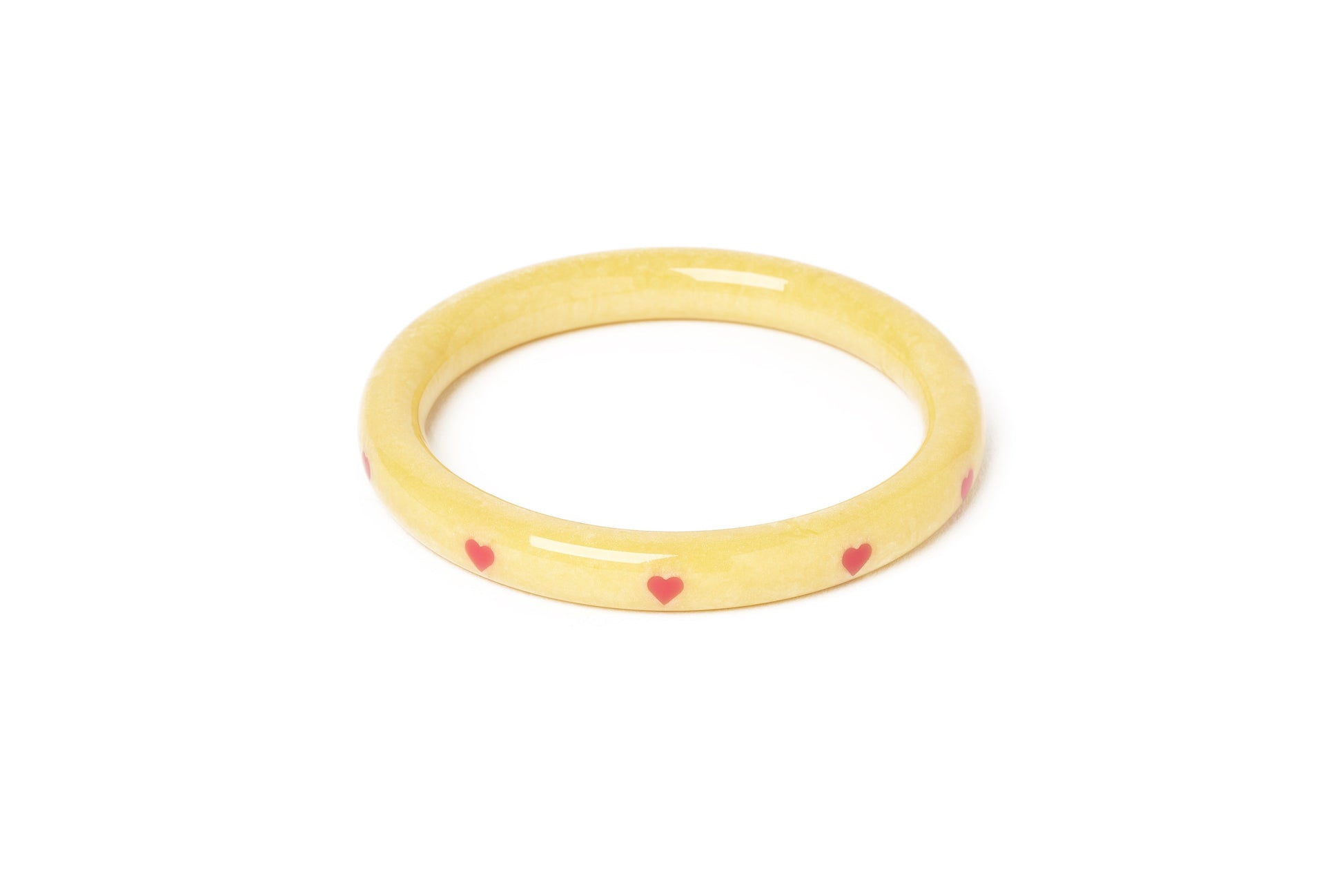 Splendette vintage inspired 1950s kitsch Valentine's style pastel yellow carved fakelite Narrow Honey Bunch Starburst Bangle
