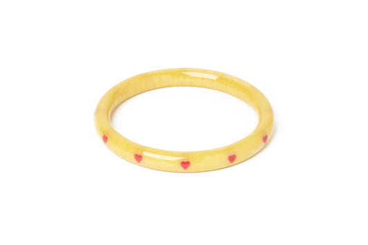 Splendette vintage inspired 1950s kitsch Valentine's style pastel yellow carved fakelite large size Narrow Honey Bunch Starburst Duchess Bangle
